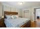 Bedroom with wood floors, a large bed, and closet space at 269 Beryl Way, Broomfield, CO 80020