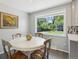 Cozy dining area with hardwood-style flooring, a round table and a bright window at 269 Beryl Way, Broomfield, CO 80020