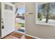 Bright entryway featuring a window, light-colored walls, and hardwood floors at 269 Beryl Way, Broomfield, CO 80020