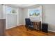Bright home office with wood floors, large windows, white trim, and a comfortable desk setup at 269 Beryl Way, Broomfield, CO 80020