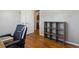Home office featuring wood floors, a comfortable chair, and ample storage at 269 Beryl Way, Broomfield, CO 80020