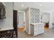 Updated kitchen with stainless steel appliances and an open view into the living room at 269 Beryl Way, Broomfield, CO 80020