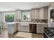Bright, updated kitchen featuring light gray cabinets, quartz counters, and a farmhouse sink at 269 Beryl Way, Broomfield, CO 80020