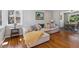 Cozy living room featuring hardwood floors, large sectional couch, and lots of natural light at 269 Beryl Way, Broomfield, CO 80020