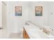 Clean bathroom featuring a white sink, mirror, and a toilet at 8944 Fox Dr # 203, Thornton, CO 80260