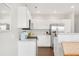 Bright kitchen featuring white cabinets, stainless steel appliances, and light countertops at 8944 Fox Dr # 203, Thornton, CO 80260
