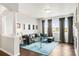 Stylish living room with dark wood floors, comfortable seating, and ample natural light at 8944 Fox Dr # 203, Thornton, CO 80260