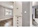 Hallway leading to bathroom and bedroom with ample closet space and natural light at 4425 S Lincoln St, Englewood, CO 80113