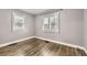 Bedroom with hardwood floors, neutral paint, plantation shutters, and lots of light at 4425 S Lincoln St, Englewood, CO 80113