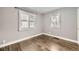 Bright bedroom with hardwood floors, neutral paint and plantation shutters at 4425 S Lincoln St, Englewood, CO 80113