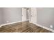 Bedroom with hardwood floors, neutral paint and large closet at 4425 S Lincoln St, Englewood, CO 80113
