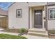 Close-up of the home's front entrance, highlighting the door and exterior details at 4425 S Lincoln St, Englewood, CO 80113