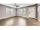 Open-concept living room with hardwood floors, plantation shutters, and ample natural light at 4425 S Lincoln St, Englewood, CO 80113