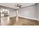 Inviting living area showcasing hardwood floors and seamless flow to the kitchen at 4425 S Lincoln St, Englewood, CO 80113