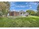 Beautiful backyard with mature trees providing privacy at 3480 S Dayton St, Denver, CO 80231