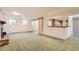 Spacious basement area featuring a brick fireplace and sliding barn doors at 3480 S Dayton St, Denver, CO 80231