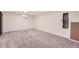 Large basement space featuring carpet floors and a small window at 3480 S Dayton St, Denver, CO 80231