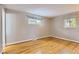 Neutral bedroom with hardwood floors and natural light coming through the windows at 3480 S Dayton St, Denver, CO 80231