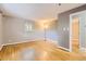 Comfortable bedroom featuring hardwood floors, ample natural light, and neutral paint at 3480 S Dayton St, Denver, CO 80231