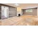 Cozy living room with hardwood floors, a fireplace and a skylight, perfect for relaxing at 3480 S Dayton St, Denver, CO 80231