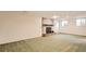 Living room featuring a brick fireplace and carpeted floors at 3480 S Dayton St, Denver, CO 80231