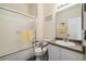 Accessible bathroom featuring a bathtub and a sink with white cabinets at 11030 Glacier Park Cir, Parker, CO 80138