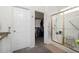 Bright bathroom featuring a walk-in shower with glass doors and a view into the closet at 11030 Glacier Park Cir, Parker, CO 80138