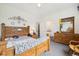 Bright bedroom showcases a large wooden bed frame and ample closet space at 11030 Glacier Park Cir, Parker, CO 80138