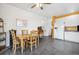 Eat-in kitchen featuring ample cabinet space, a tile floor, and a dining area for casual meals at 11030 Glacier Park Cir, Parker, CO 80138