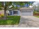 Charming single-Gathering home showcasing a well-maintained lawn and a two-car garage at 11030 Glacier Park Cir, Parker, CO 80138
