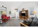 Bright living room with large windows, offering ample natural light and a welcoming space for gatherings at 11030 Glacier Park Cir, Parker, CO 80138