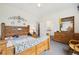 A light-filled main bedroom featuring carpet, a wooden bed set, and decor at 11030 Glacier Park Cir, Parker, CO 80138