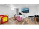 Finished basement with wood floors, neutral walls, and a cozy fireplace, great for relaxing at 1818 South Union Ct, Lakewood, CO 80228
