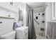 Compact bathroom with a sink, shower and tile accents at 1818 South Union Ct, Lakewood, CO 80228