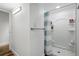Modern bathroom featuring a walk-in shower, neutral tones, and bright lighting at 1818 South Union Ct, Lakewood, CO 80228