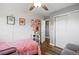 bedroom with cute decor and wood-look floors at 1818 South Union Ct, Lakewood, CO 80228