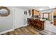 Inviting kitchen bar area featuring counter seating and direct views to nearby storage cabinets at 1818 South Union Ct, Lakewood, CO 80228