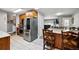 Well-equipped kitchen featuring stainless steel appliances and a breakfast bar perfect for casual dining at 1818 South Union Ct, Lakewood, CO 80228
