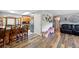 Open-concept kitchen featuring a breakfast bar that seamlessly connects to a cozy living space at 1818 South Union Ct, Lakewood, CO 80228