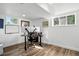 Basement office with desk setup, bright lighting, and multiple windows for natural light at 1818 South Union Ct, Lakewood, CO 80228