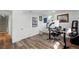 Bright basement office with neutral walls, wood floors, and a functional workspace setup at 1818 South Union Ct, Lakewood, CO 80228