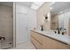 Sleek bathroom featuring a floating vanity, modern lighting, and a glass-enclosed shower at 974 N Faver Dr, Castle Rock, CO 80109