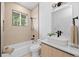 Modern bathroom with a soaking tub, stylish vanity, and contemporary fixtures at 974 N Faver Dr, Castle Rock, CO 80109