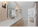 Bright and modern bathroom featuring a long vanity, stylish mirror, and open shelving at 974 N Faver Dr, Castle Rock, CO 80109