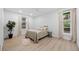Bright bedroom with modern flooring, neutral tones, and large windows providing natural light at 974 N Faver Dr, Castle Rock, CO 80109