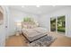 Bright bedroom with hardwood floors, natural light, and access to the backyard at 974 N Faver Dr, Castle Rock, CO 80109