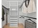Organized walk-in closet with hanging racks, shelving, and drawers for optimal storage at 974 N Faver Dr, Castle Rock, CO 80109