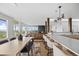 Open dining area with large windows, hardwood floors, and an elegant table with views at 974 N Faver Dr, Castle Rock, CO 80109