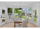Sunlit dining area with picturesque views of the backyard and patio at 974 N Faver Dr, Castle Rock, CO 80109