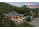 Charming home featuring a spacious deck and picturesque views of the surrounding hillside at 974 N Faver Dr, Castle Rock, CO 80109
